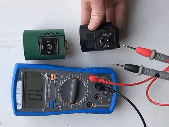 use a multimeter to test the solenoid valve coils